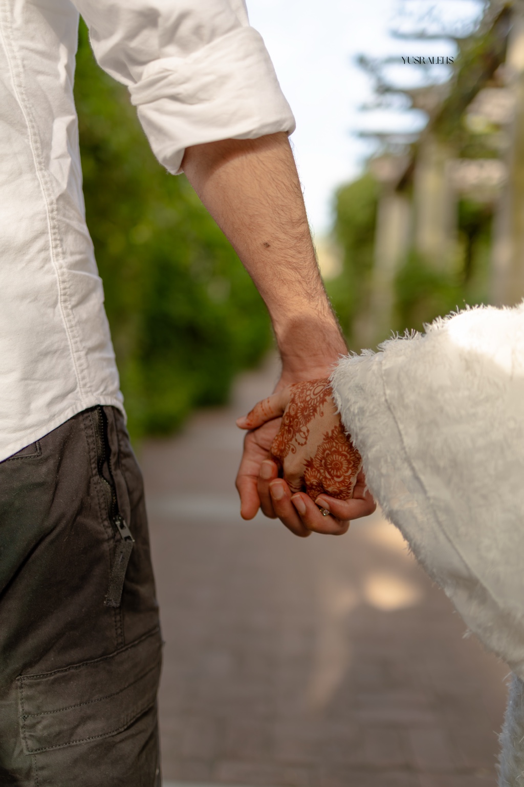 Imran and Siddiqa holding hands